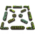 Letter-shaped garden planters with plants arranged to form the word 'GARDEN' on a white background. 