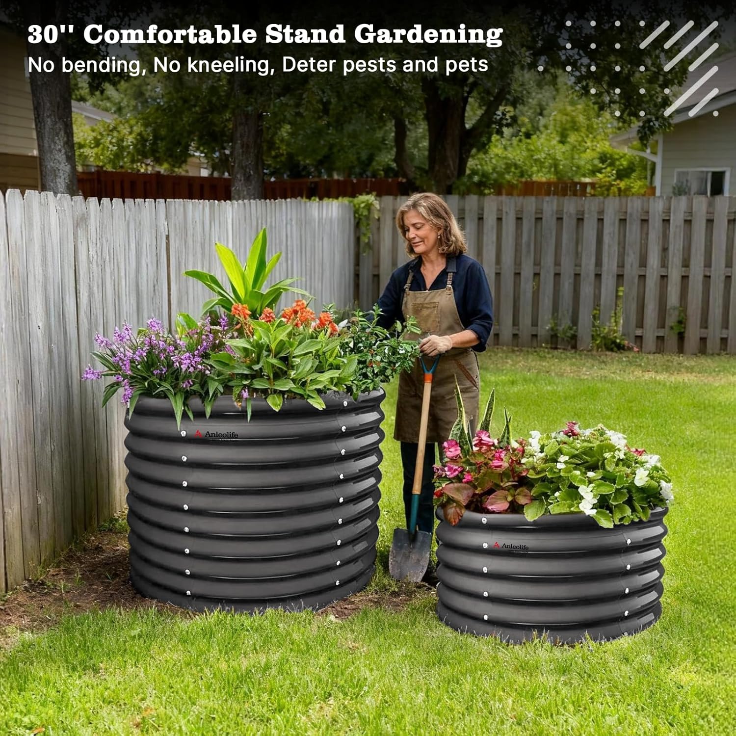 Woman gardening with large black planters filled with plants in a backyard setting. 