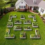 Geometric garden design with plants in front of a house 
