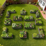 Geometric arrangement of garden beds with plants on a grassy lawn. 