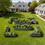 Garden with raised beds filled with plants in a residential backyard. 