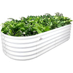 White metal raised garden bed with green plants on a white background 