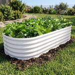White corrugated metal garden bed with green plants in a garden setting 