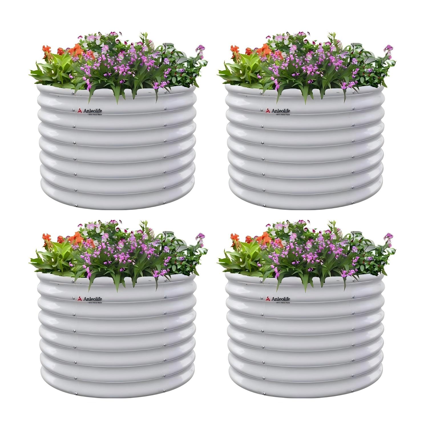 Four white ribbed planters with flowers on a white background 