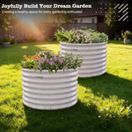 Two white corrugated planters with plants on a grassy lawn, promoting gardening. 